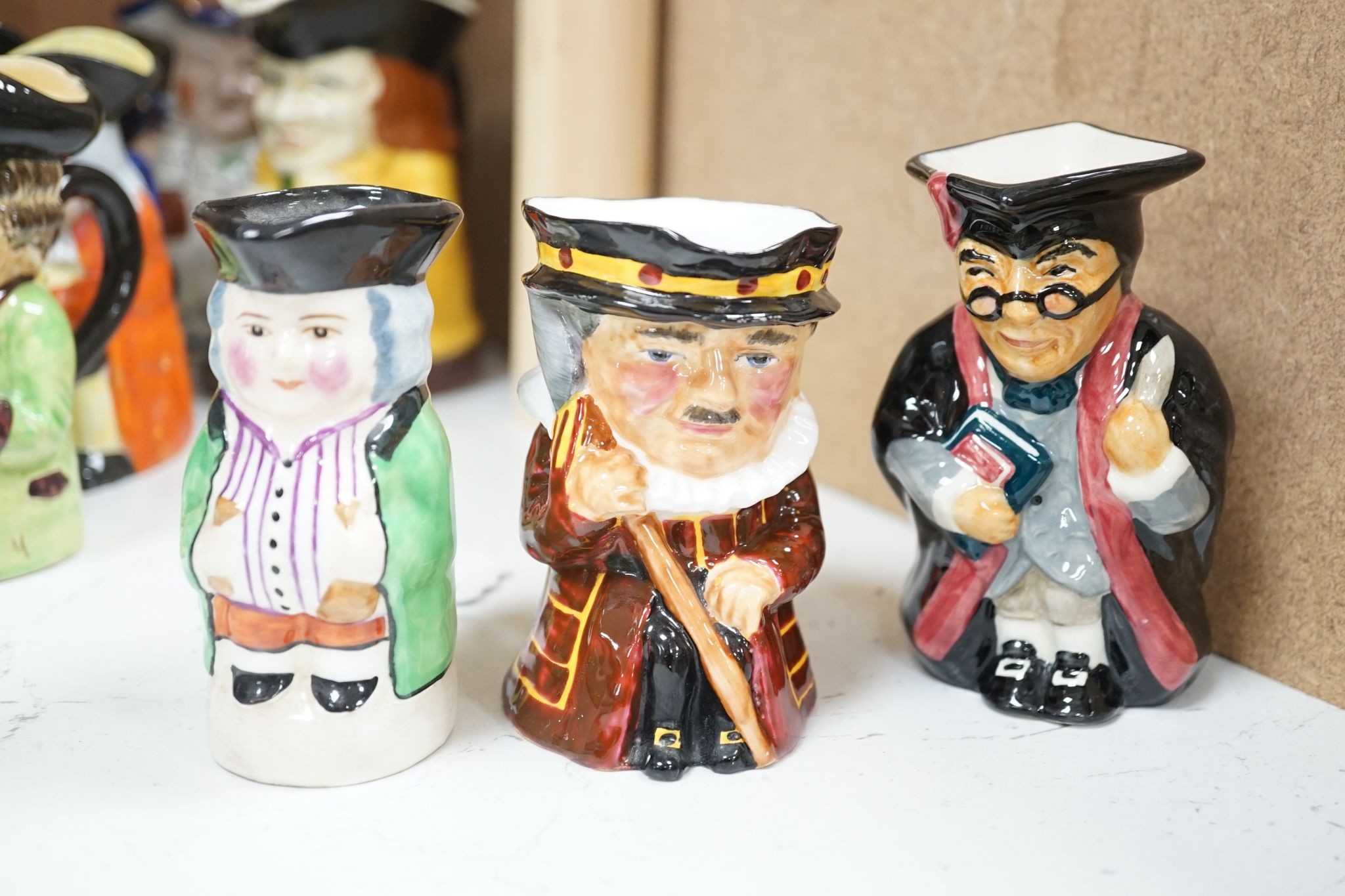 A Sylvac Coachman Toby jug, and eleven others, tallest 17cm